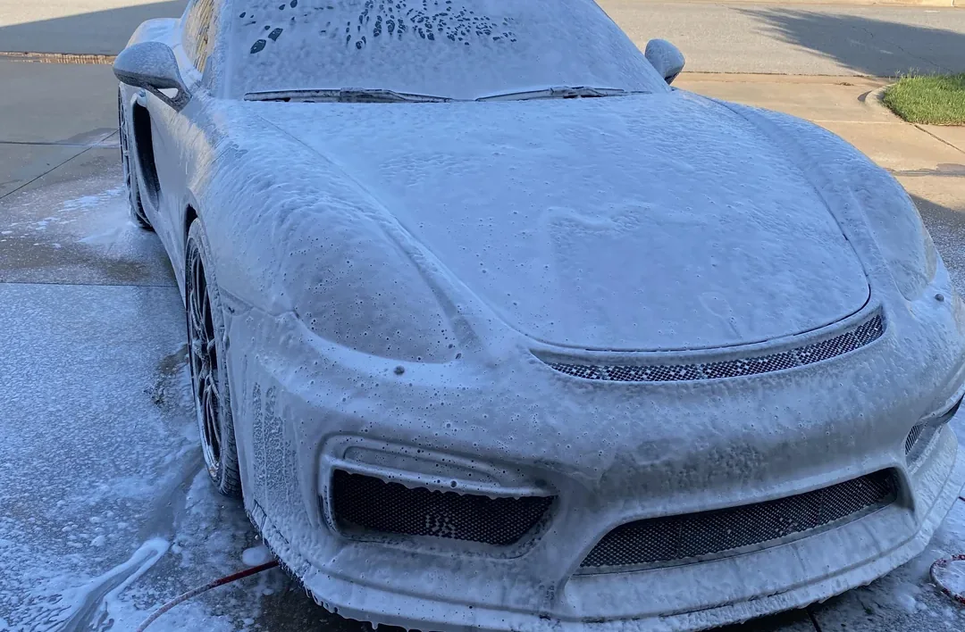 Exterior of a car being washed and dried during a detail